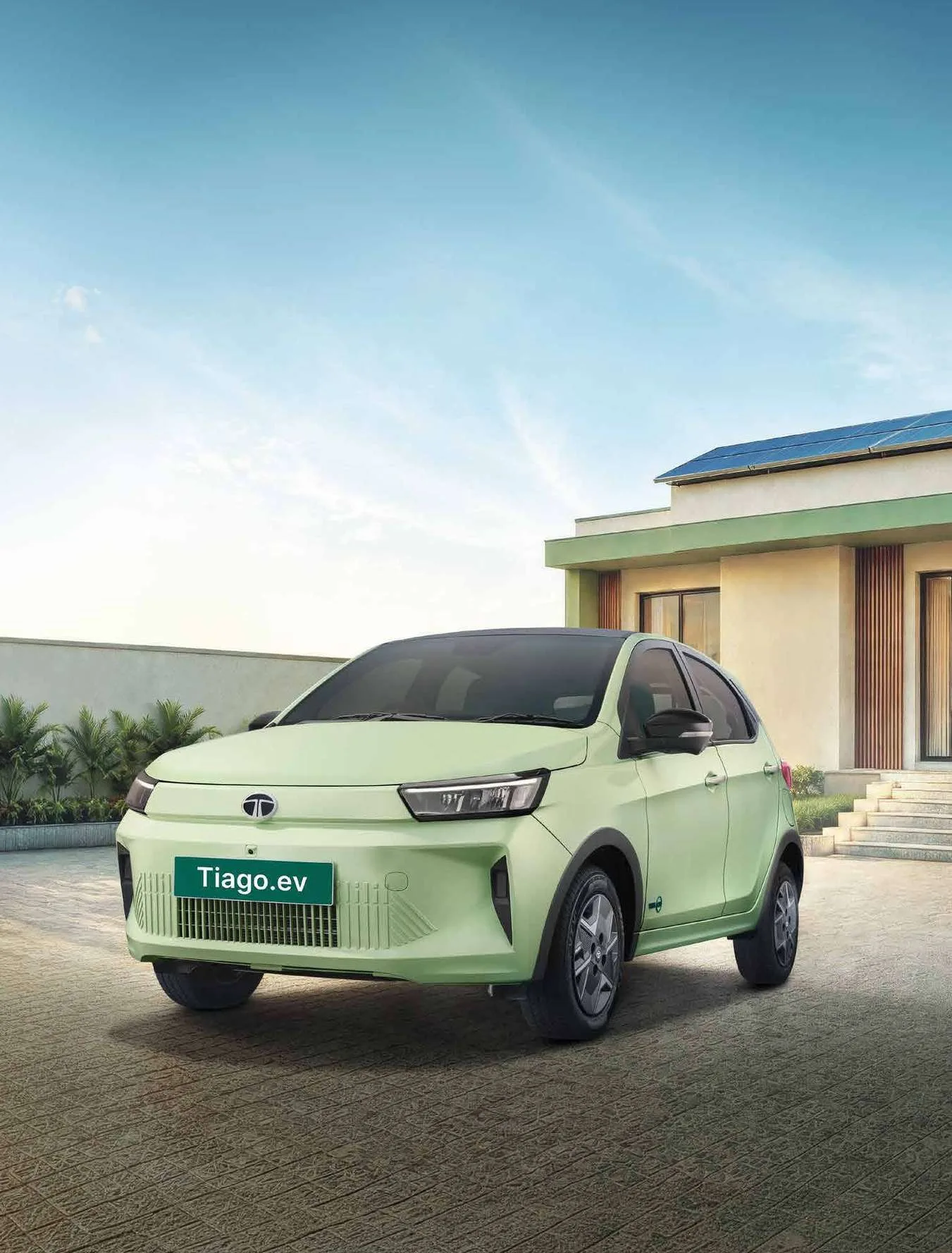 Tata Tiago EV driving out of a driveway