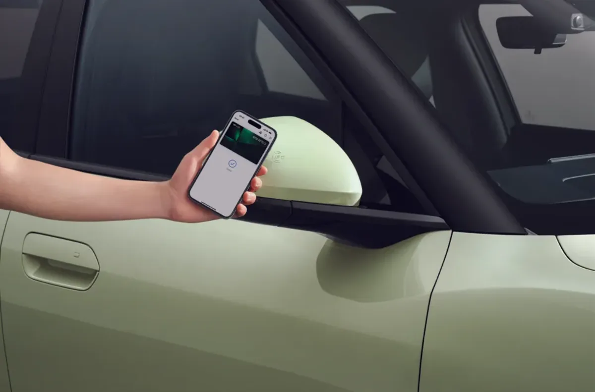 Phone held to the door mirror as a digital key
