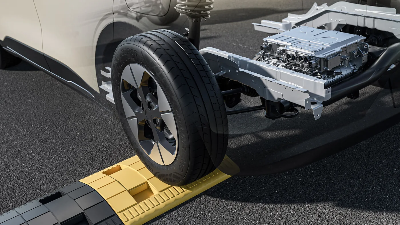 Proton e.MAS 5 rear suspension over a speed breaker
