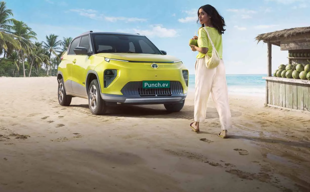 Refreshed Tata Punch EV in yellow parked on a beach
