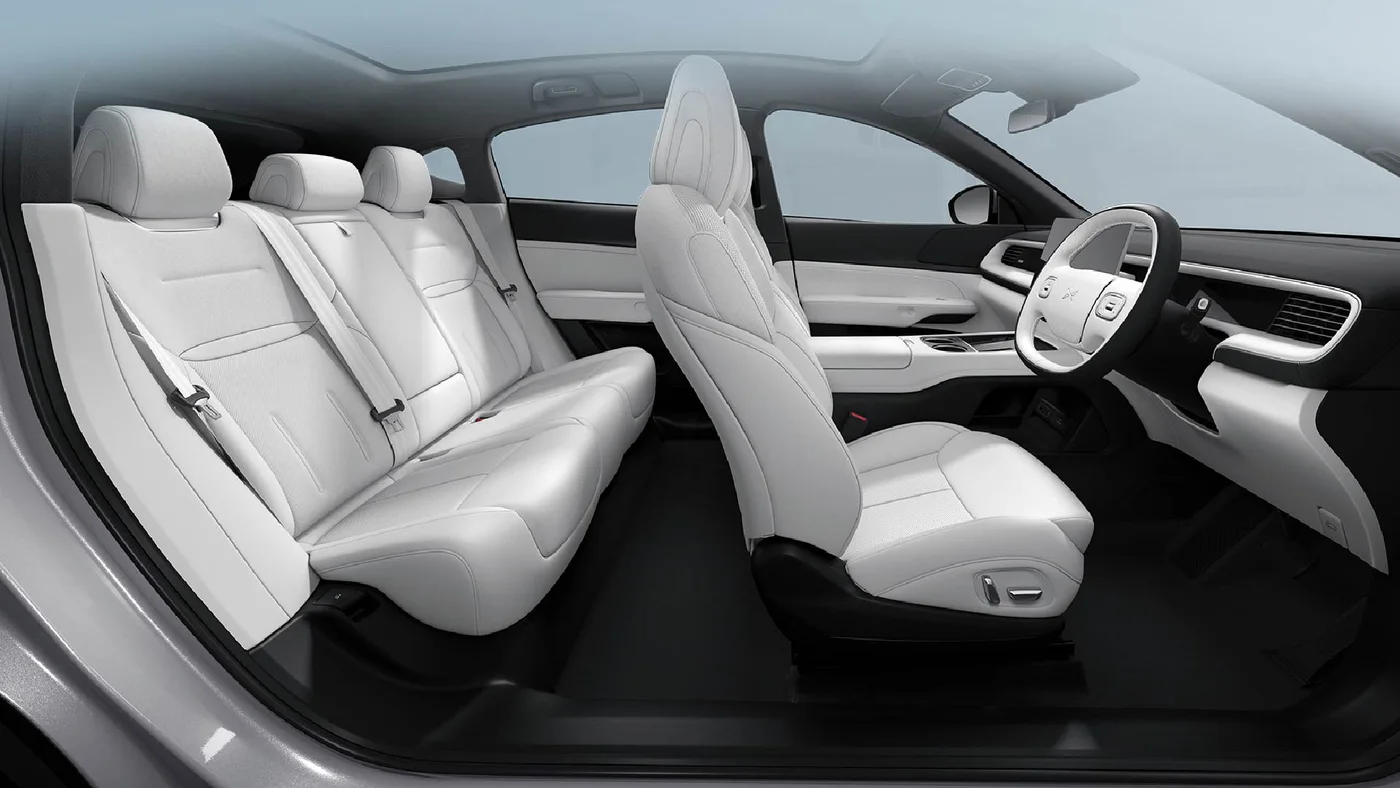 XPENG G6 cabin seen through the open doors, showing front and rear seats
